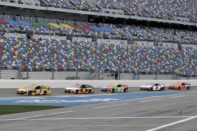 Erik Jones (20) leads Christopher Bell (95), Kyle Busch (18), Denny Hamlin (11) and Martin Truex Jr. (19) in a draft during practice for the NASCAR Daytona 500 auto race Friday, Feb. 14, 2020, at Daytona International Speedway in Daytona Beach, Fla. (AP Photo/Chris O'Meara)