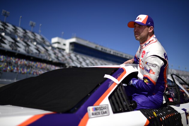 DAYTONA BEACH, FLORIDA - FEBRUARY 09: Denny Hamlin, driver of the #11 FedEx Express Toyota, climbs into his car during qualifying for the NASCAR Cup Series 62nd Annual Daytona 500 at Daytona International Speedway on February 09, 2020 in Daytona Beach, Florida. (Photo by Jared C. Tilton/Getty Images)