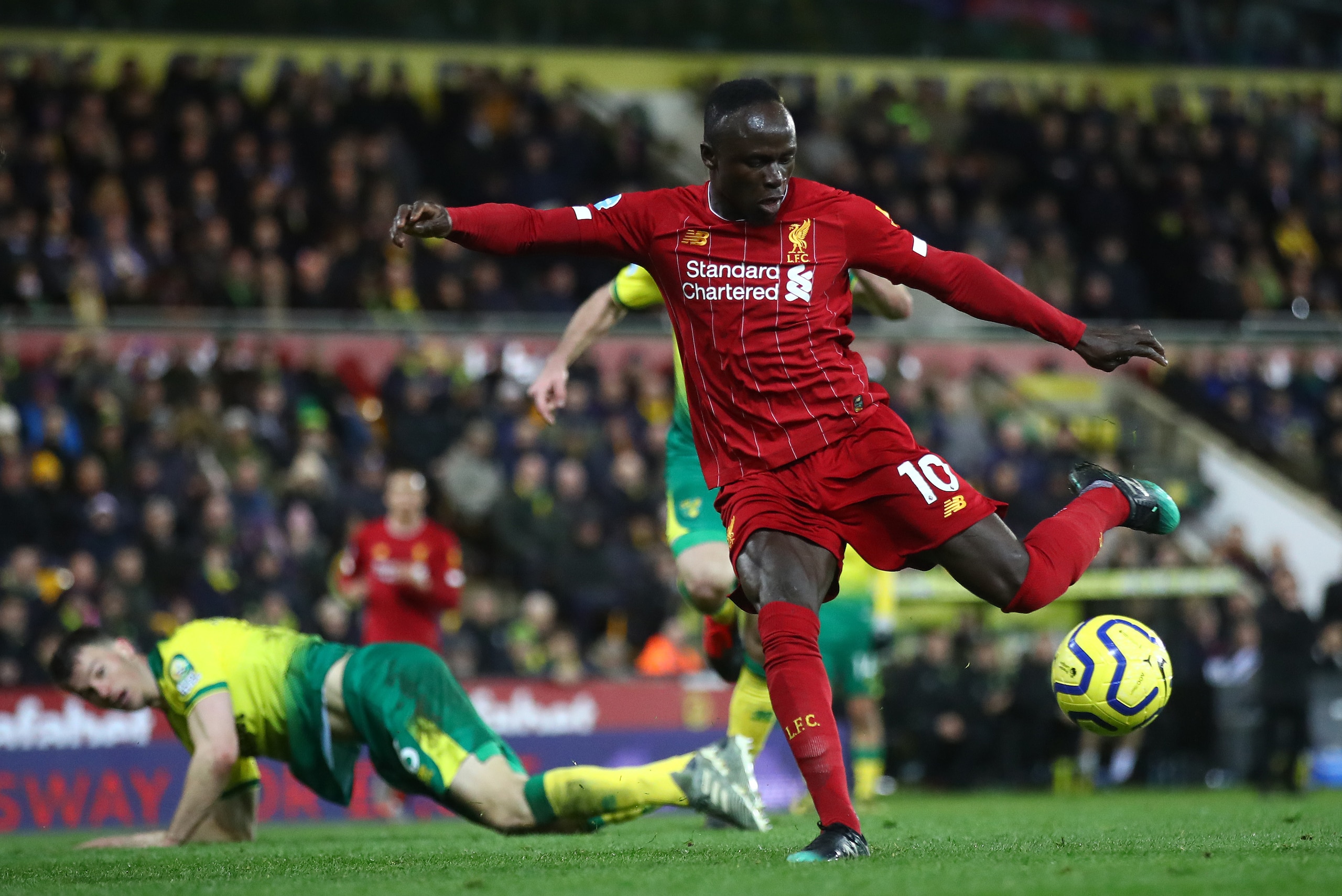 NORWICH, ENGLAND - FEBRUARY 15: Sadio Mane of Liverpool scores his team's first goal during the Premier League match between Norwich City and Liverpool FC at Carrow Road on February 15, 2020 in Norwich, United Kingdom. (Photo by Julian Finney/Getty Images) NORWICH, ENGLAND - FEBRUARY 15: Sadio Mane of Liverpool scores his team's first goal during the Premier League match between Norwich City and Liverpool FC at Carrow Road on February 15, 2020 in Norwich, United Kingdom. (Photo by Julian Finney/Getty Images)