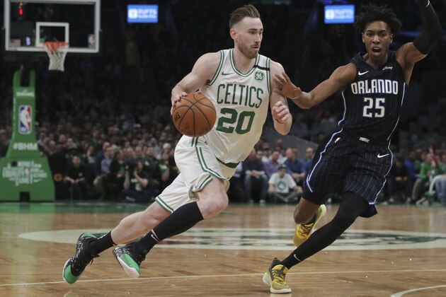 Boston Celtics forward Gordon Hayward (20) drives to the basket past Orlando Magic forward Wes Iwundu (25) during the second quarter of an NBA basketball game in Boston, Wednesday, Feb. 5, 2020. (AP Photo/Charles Krupa)