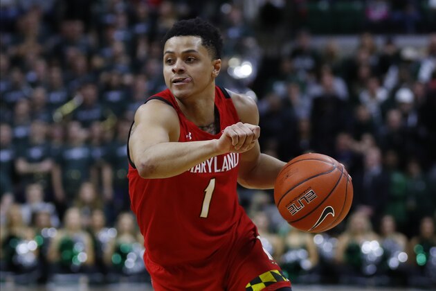 Maryland guard Anthony Cowan Jr. plays against Michigan State in the first half of an NCAA college basketball game in East Lansing, Mich., Saturday, Feb. 15, 2020. (AP Photo/Paul Sancya)