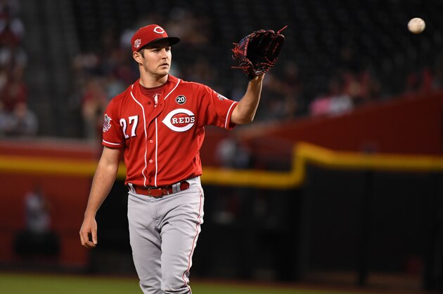 PHOENIX, ARIZONA - SEPTEMBER 15: Trevor Bauer #27 of the Cincinnati Reds catches a throw back from home plate during a game against the Arizona Diamondbacks at Chase Field on September 15, 2019 in Phoenix, Arizona. (Photo by Norm Hall/Getty Images)
