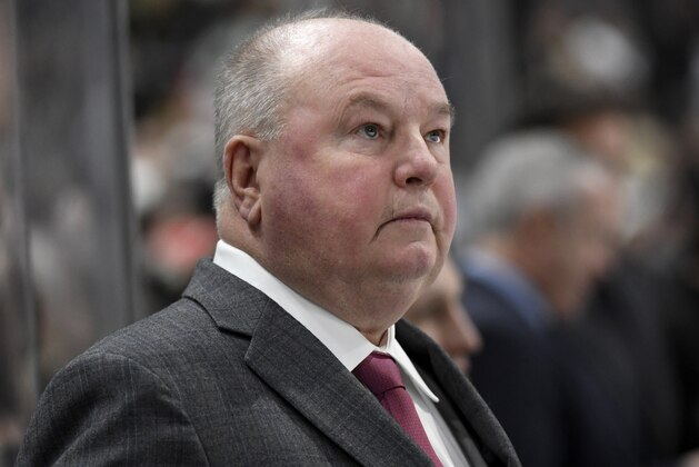 Minnesota Wild head coach Bruce Boudreau watches from the bench as his team plays against the Tampa Bay Lightning during the second period of an NHL hockey game Thursday, Jan. 16, 2020, in St. Paul, Minn. (AP Photo/Hannah Foslien)