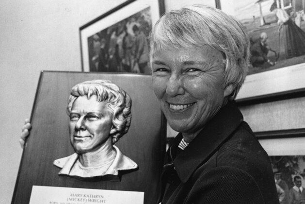 FILE - In this Sept. 8, 1976 file photo, golfer Mickey Wright holds a World Golf Hall of Fame plaque bearing her likeness in Pinehurst, N.C. Wright has agreed to donate some 200 personal artifacts for a permanent display at the U.S. Golf Association Museum in Far Hills, N.J. Wright will be only the fourth player--and first woman--to have a gallery in her name at the museum. The others are for Hogan, Bobby Jones and Arnold Palmer. It is scheduled to open in June. (AP Photo/File)
