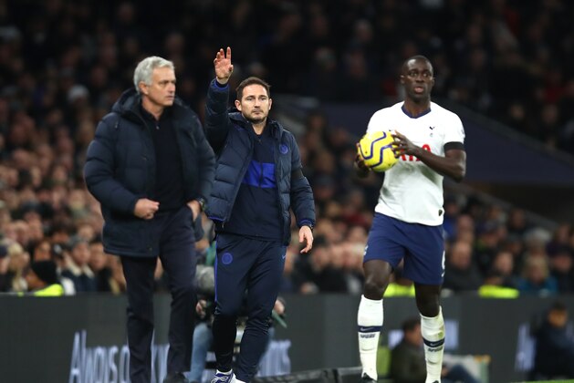 LONDON, ENGLAND - DECEMBER 22: Frank Lampard, Manager of Chelsea next to Jose Mourinho, Manager of Tottenham Hotspur and Davinson Sanchez of Tottenham Hotspur  during the Premier League match between Tottenham Hotspur and Chelsea FC at Tottenham Hotspur Stadium on December 22, 2019 in London, United Kingdom. (Photo by Julian Finney/Getty Images)