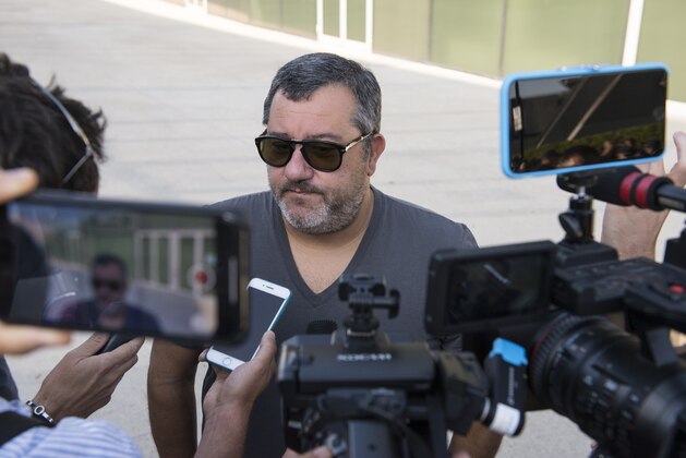 TURIN, ITALY - JULY 17: Agent Mino Raiola accompanies Matthijs De Ligt as he arrives in Turin ahead of his signing with Juventus FC on July 17, 2019 in Turin, Italy. (Photo by Stefano Guidi/Getty Images)
