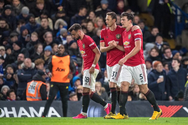 LONDON, ENGLAND - FEBRUARY 17: Harry Maguire of Manchester United celebrates with Nemanja Matic and Bruno Fernandes after scoring the second goal during the Premier League match between Chelsea FC and Manchester United at Stamford Bridge on February 17, 2020 in London, United Kingdom. (Photo by Sebastian Frej/MB Media/Getty Images)