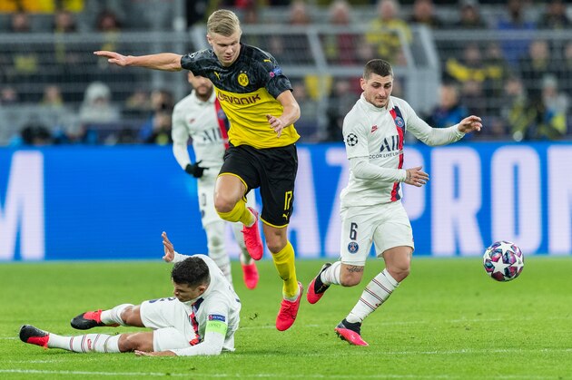 DORTMUND, GERMANY - FEBRUARY 18: Erling Braut Haaland of Borussia Dortmund is challenged by Marco Verratti of Paris Saint-Germain and Thiago Silva of Paris Saint-Germain during the UEFA Champions League round of 16 first leg match between Borussia Dortmund and Paris Saint-Germain at Signal Iduna Park on February 18, 2020 in Dortmund, Germany. (Photo by Boris Streubel/Getty Images)