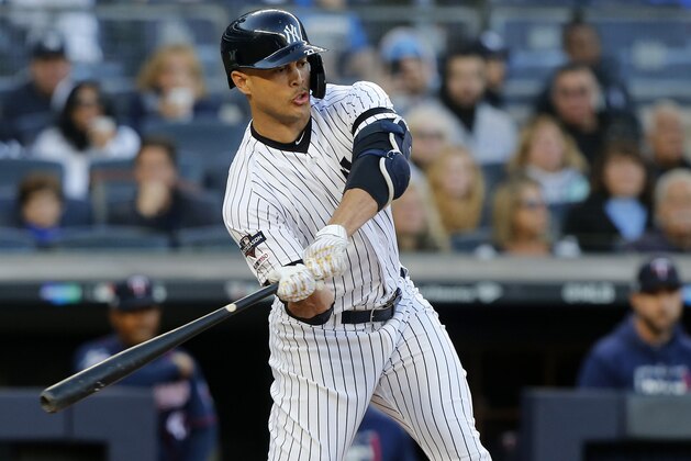 NEW YORK, NEW YORK - OCTOBER 05:  (NEW YORK DAILIES OUT)   Giancarlo Stanton #27 of the New York Yankees in action against the Minnesota Twins in game two of the American League Division Series at Yankee Stadium on October 05, 2019 in New York City. The Yankees defeated the Twins 8-2.  (Photo by Jim McIsaac/Getty Images)