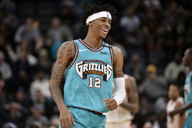 Memphis Grizzlies guard Ja Morant (12) reacts in the first half of an NBA basketball game against the Portland Trail Blazers Wednesday, Feb. 12, 2020, in Memphis, Tenn. (AP Photo/Brandon Dill)