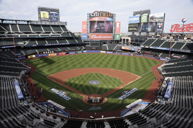 FILE - In this Oct. 29, 2015, file photo, members of the media and grounds crew work on the field at Citi Field in New York, the day before Game 3 of the World Series between the Mets and the Kansas City Royals at the stadium. Baseball Commissioner Rob Manfred says talks have ended over the proposed sale of a controlling share of the Mets from the families of Fred Wilpon and Saul Katz to hedge fund manager Steven Cohen. (AP Photo/Peter Morgan, File) FILE - In this Oct. 29, 2015, file photo, members of the media and grounds crew work on the field at Citi Field in New York, the day before Game 3 of the World Series between the Mets and the Kansas City Royals at the stadium. Baseball Commissioner Rob Manfred says talks have ended over the proposed sale of a controlling share of the Mets from the families of Fred Wilpon and Saul Katz to hedge fund manager Steven Cohen. (AP Photo/Peter Morgan, File)