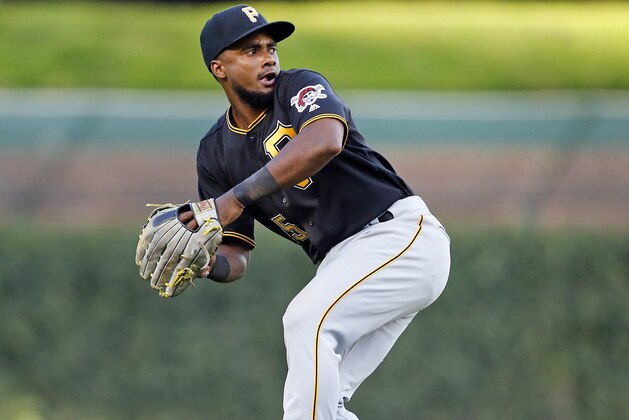 CHICAGO, ILLINOIS - SEPTEMBER 13: Pablo Reyes #15 of the Pittsburgh Pirates picks up the RBI single hit by Tony Kemp #4 of the Chicago Cubs during the fifth inning of a game at Wrigley Field on September 13, 2019 in Chicago, Illinois. (Photo by Nuccio DiNuzzo/Getty Images)