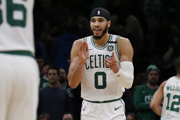 Boston Celtics forward Jayson Tatum (0) claps late during the second half of an NBA basketball game against the Atlanta Hawks, Friday, Feb. 7, 2020, in Boston. (AP Photo/Mary Schwalm)