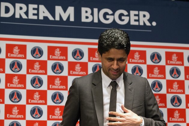 FILE - In this May 17, 2013 file photo, Paris Saint-Germain soccer club President Nasser Al-Khelaifi, arrives to speak to the media during a press conference at Parc des Princes stadium in Paris. A French judicial official says Al-Khelaifi has been placed under investigation for suspected corruption. (AP Photo/Michel Euler, File)
