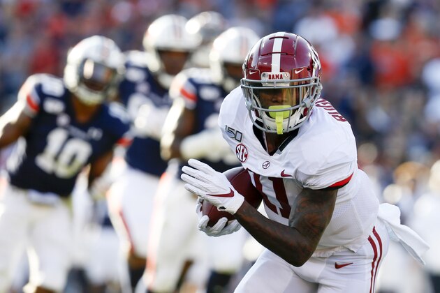 Alabama wide receiver Henry Ruggs III (11) catches a pass against Auburn during the first half of an NCAA college football game Saturday, Nov. 30, 2019, in Auburn, Ala. (AP Photo/Butch Dill)