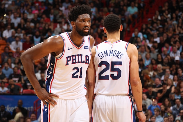 MIAMI, FL - DECEMBER 28: Ben Simmons #25 of the Philadelphia 76ers and Joel Embiid #21 of the Philadelphia 76ers looks on during the game against the Miami Heat on December 28, 2019 at American Airlines Arena in Miami, Florida. NOTE TO USER: User expressly acknowledges and agrees that, by downloading and or using this Photograph, user is consenting to the terms and conditions of the Getty Images License Agreement. Mandatory Copyright Notice: Copyright 2020 NBAE (Photo by Oscar Baldizon/NBAE via Getty Images)
