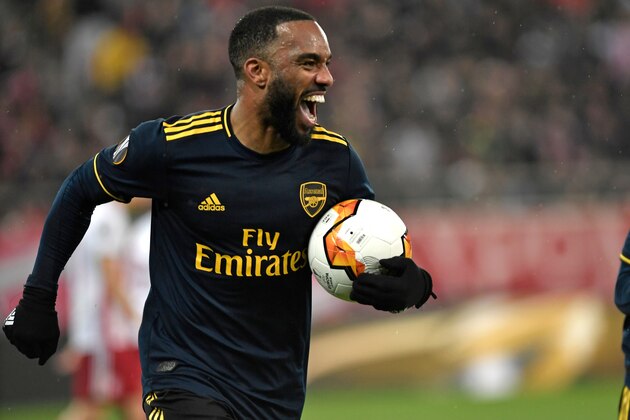 Arsenal's French striker Alexandre Lacazette celebrates after he scores the opening goal of the UEFA Europa League round of 32 first leg football match between Olympiakos and Arsenal at the Karaiskakis Stadium in Piraeus, near Athens, on February 20, 2020. (Photo by LOUISA GOULIAMAKI / AFP) (Photo by LOUISA GOULIAMAKI/AFP via Getty Images)