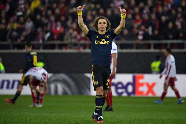 Arsenal's Brazilian defender David Luiz celebrates their win on the pitch after the UEFA Europa League round of 32 first leg football match between Olympiakos and Arsenal at the Karaiskakis Stadium in Piraeus, near Athens, on February 20, 2020. - Arsenal won the game 1-0. (Photo by ARIS MESSINIS / AFP) (Photo by ARIS MESSINIS/AFP via Getty Images)