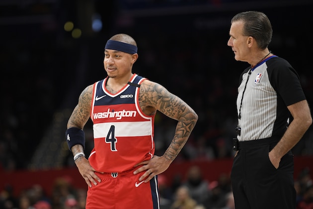 Washington Wizards guard Isaiah Thomas (4) stands next to referee Ken Mauer (41) during the second half of an NBA basketball game against the Brooklyn Nets, Saturday, Feb. 1, 2020, in Washington. The Wizards won 113-107. (AP Photo/Nick Wass)