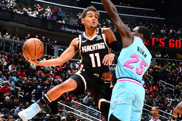 ATLANTA, GA - FEBRUARY 2020: Trae Young #11 of the Atlanta Hawks looks to pass the ball against the Miami Heat on February 20, 2020 at State Farm Arena in Atlanta, Georgia. NOTE TO USER: User expressly acknowledges and agrees that, by downloading and/or using this Photograph, user is consenting to the terms and conditions of the Getty Images License Agreement. Mandatory Copyright Notice: Copyright 2020 NBAE (Photo by Scott Cunningham/NBAE via Getty Images) ATLANTA, GA - FEBRUARY 2020: Trae Young #11 of the Atlanta Hawks looks to pass the ball against the Miami Heat on February 20, 2020 at State Farm Arena in Atlanta, Georgia. NOTE TO USER: User expressly acknowledges and agrees that, by downloading and/or using this Photograph, user is consenting to the terms and conditions of the Getty Images License Agreement. Mandatory Copyright Notice: Copyright 2020 NBAE (Photo by Scott Cunningham/NBAE via Getty Images)