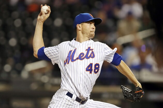 FILE - In this Sept. 25, 2019, file photo, New York Mets starting pitcher Jacob deGrom throws during the first inning of a baseball game against the Miami Marlins in New York. The right hander is coming off his second consecutive Cy Young Award(AP Photo/Kathy Willens, File)
