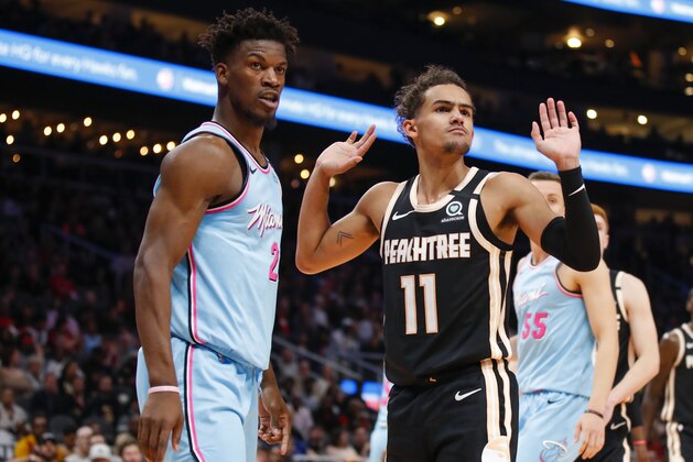 ATLANTA, GA - FEBRUARY 20: Trae Young #11 of the Atlanta Hawks reacts alongside Jimmy Butler #22 of the Miami Heat during the second half of an NBA game at State Farm Arena on February 20, 2020 in Atlanta, Georgia. NOTE TO USER: User expressly acknowledges and agrees that, by downloading and/or using this photograph, user is consenting to the terms and conditions of the Getty Images License Agreement. (Photo by Todd Kirkland/Getty Images)