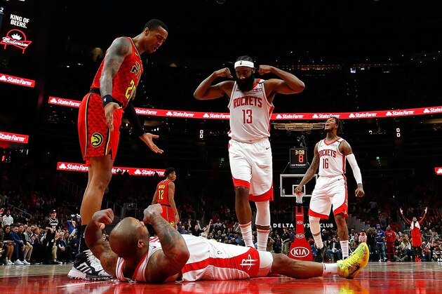 ATLANTA, GEORGIA - JANUARY 08:  PJ Tucker #17 of the Houston Rockets reacts towards James Harden #13 after drawing a charge from Alex Len #25 of the Atlanta Hawks to force a turnover in the second half at State Farm Arena on January 08, 2020 in Atlanta, Georgia.  NOTE TO USER: User expressly acknowledges and agrees that, by downloading and/or using this photograph, user is consenting to the terms and conditions of the Getty Images License Agreement.  (Photo by Kevin C. Cox/Getty Images)