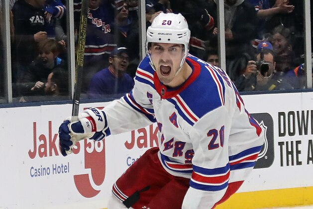 UNIONDALE, NEW YORK - JANUARY 16: Chris Kreider #20 of the New York Rangers scores the game winning goal on the power-play at 19:35 of the third period against the New York Islanders at NYCB Live's Nassau Coliseum on January 16, 2020 in Uniondale, New York. The Rangers defeated the Islanders 3-2.  (Photo by Bruce Bennett/Getty Images)