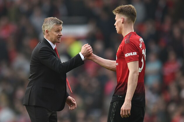 Manchester United's Norwegian caretaker manager Ole Gunnar Solskjaer (L) shakes hands with Manchester United's English midfielder Scott McTominay (R) after the final whistle of the English Premier League football match between Manchester United and Liverpool at Old Trafford in Manchester, north west England, on February 24, 2019. (Photo by Oli SCARFF / AFP) / RESTRICTED TO EDITORIAL USE. No use with unauthorized audio, video, data, fixture lists, club/league logos or 'live' services. Online in-match use limited to 120 images. An additional 40 images may be used in extra time. No video emulation. Social media in-match use limited to 120 images. An additional 40 images may be used in extra time. No use in betting publications, games or single club/league/player publications. / (Photo credit should read OLI SCARFF/AFP via Getty Images) Manchester United's Norwegian caretaker manager Ole Gunnar Solskjaer (L) shakes hands with Manchester United's English midfielder Scott McTominay (R) after the final whistle of the English Premier League football match between Manchester United and Liverpool at Old Trafford in Manchester, north west England, on February 24, 2019. (Photo by Oli SCARFF / AFP) / RESTRICTED TO EDITORIAL USE. No use with unauthorized audio, video, data, fixture lists, club/league logos or 'live' services. Online in-match use limited to 120 images. An additional 40 images may be used in extra time. No video emulation. Social media in-match use limited to 120 images. An additional 40 images may be used in extra time. No use in betting publications, games or single club/league/player publications. / (Photo credit should read OLI SCARFF/AFP via Getty Images)