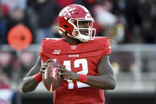 DC Defenders quarterback Cardale Jones (12) looks to pass against the Seattle Dragons during an XFL football game, Saturday, Feb. 8, 2020, in Washington. (AP Photo/Will Newton)