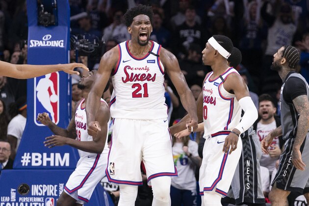 PHILADELPHIA, PA - FEBRUARY 20: Joel Embiid #21 of the Philadelphia 76ers reacts at the end of the fourth quarter against the Brooklyn Nets at the Wells Fargo Center on February 20, 2020 in Philadelphia, Pennsylvania. The 76ers defeated the Nets 112-104 in overtime. NOTE TO USER: User expressly acknowledges and agrees that, by downloading and/or using this photograph, user is consenting to the terms and conditions of the Getty Images License Agreement. (Photo by Mitchell Leff/Getty Images)