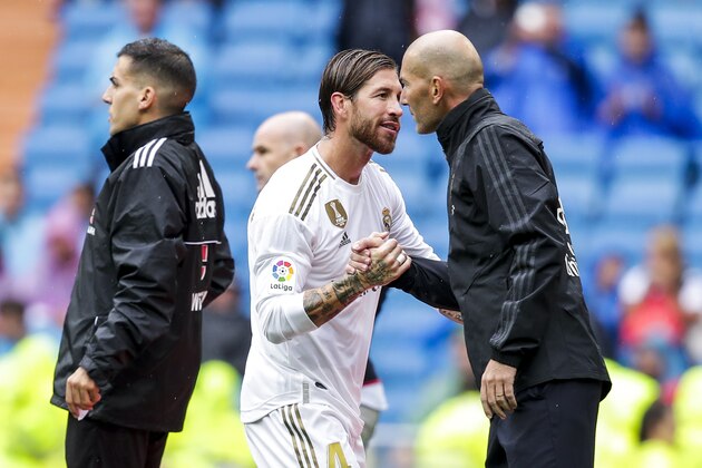 MADRID, SPAIN - SEPTEMBER 14: (L-R) Sergio Ramos of Real Madrid, coach Zinedine Zidane of Real Madrid during the La Liga Santander  match between Real Madrid v Levante at the Santiago Bernabeu on September 14, 2019 in Madrid Spain (Photo by David S. Bustamante/Soccrates/Getty Images)