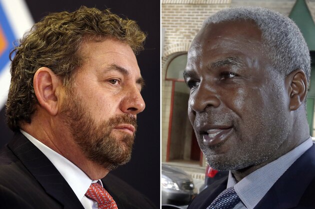 FILE - At left, in a March 18, 2014, file photo, James Dolan, executive chairman of Madison Square Garden, listens to a question at a news conference, in New York. At right, in an April 11, 2017, file photo, former New York Knicks basketball player Charles Oakley talks to the press after an appearance in Manhattan Criminal Court, in New York. New York Knicks great Charles Oakley is tired of