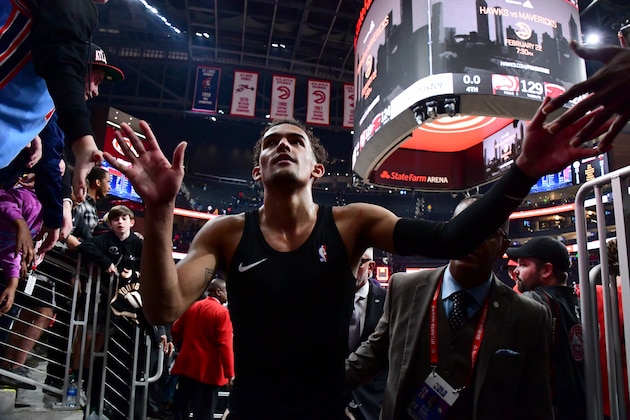 ATLANTA, GA - FEBRUARY 2020: Trae Young #11 of the Atlanta Hawks high fives the fans after the game against the Miami Heat on February 20, 2020 at State Farm Arena in Atlanta, Georgia.  NOTE TO USER: User expressly acknowledges and agrees that, by downloading and/or using this Photograph, user is consenting to the terms and conditions of the Getty Images License Agreement. Mandatory Copyright Notice: Copyright 2020 NBAE (Photo by Scott Cunningham/NBAE via Getty Images)