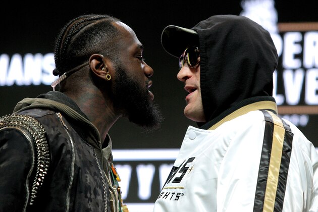 US boxer Deontay Wilder (L) and British boxer Tyson Fury get into an altercation during their press conference February 19, 2020 at the MGM Grand Las Vegas in Las Vegas, Nevada. - The boxers will fight for the World Boxing Council (WBC) Heavyweight Championship Title on February 22, 2020 at the MGM Grand Garden Arena in Las Vegas. (Photo by John Gurzinski / AFP) (Photo by JOHN GURZINSKI/AFP via Getty Images)