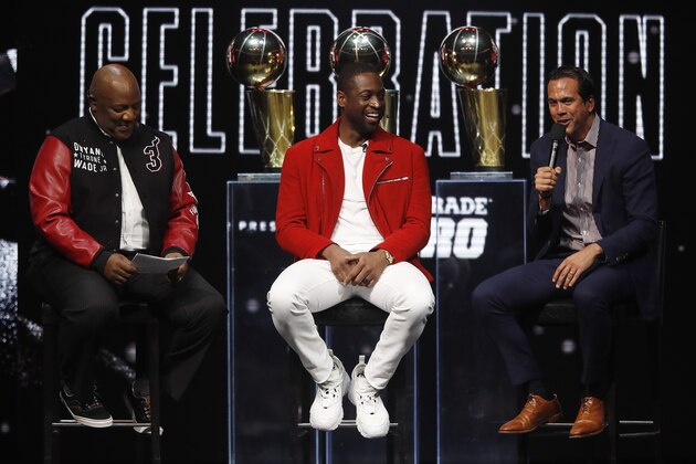 MIAMI, FLORIDA - FEBRUARY 21:  Former Miami Heat player Dwyane Wade laughs with head coach Erik Spoelstra and host Jason Jackson during the Miami Heat Dwyane Wade L3GACY Celebration at American Airlines Arena on February 21, 2020 in Miami, Florida. (Photo by Michael Reaves/Getty Images)