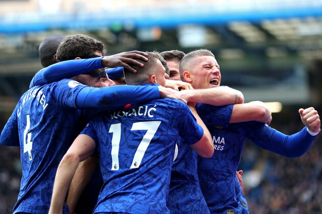 LONDON, ENGLAND - FEBRUARY 22: Marcos Alonso of Chelsea (obscured) celebrates with teammates Mateo Kovacic, Andreas Christensen, Ross Barkley, Olivier Giroud and Mason Mount after scoring his team's second goal during the Premier League match between Chelsea FC and Tottenham Hotspur at Stamford Bridge on February 22, 2020 in London, United Kingdom. (Photo by Catherine Ivill/Getty Images)