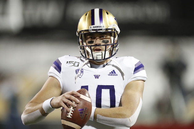 Washington quarterback Jacob Eason (10) warms up before the first half of an NCAA college football game Saturday, Nov. 23, 2019, in Boulder, Colo. (AP Photo/David Zalubowski)