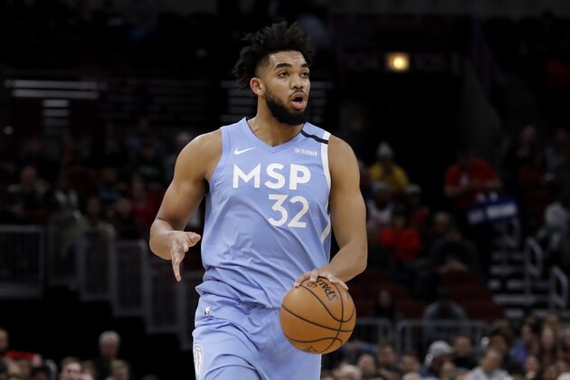 Minnesota Timberwolves center Karl-Anthony Towns controls the ball against the Chicago Bulls during the first half of an NBA basketball game in Chicago, Wednesday, Jan. 22, 2020. (AP Photo/Nam Y. Huh)
