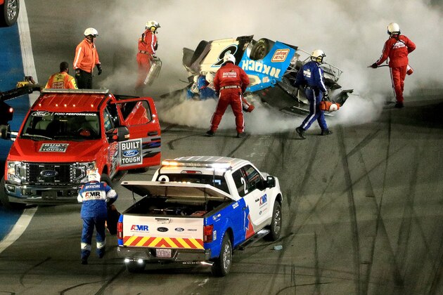 DAYTONA BEACH, FLORIDA - FEBRUARY 17:  Track workers attend to Ryan Newman, driver of the #6 Koch Industries Ford, following a crash during the NASCAR Cup Series 62nd Annual Daytona 500 at Daytona International Speedway on February 17, 2020 in Daytona Beach, Florida. (Photo by Mike Ehrmann/Getty Images)