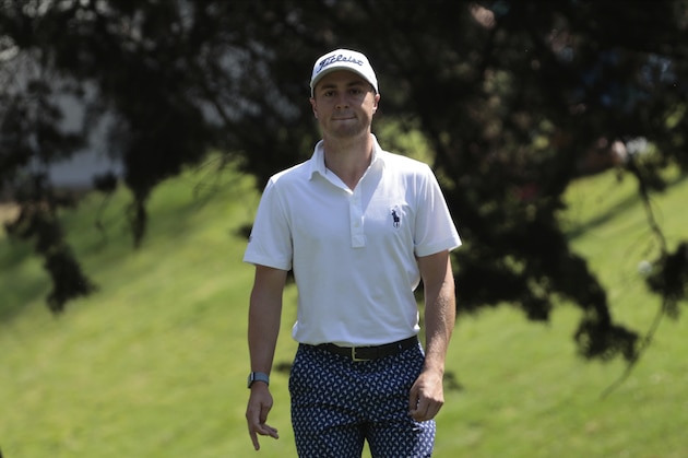 Justin Thomas of United States studies his second shot on the first green during the third round for the WGC-Mexico Championship golf tournament, at the Chapultepec Golf Club in Mexico City, Saturday, Feb. 22, 2020.(AP Photo/Fernando Llano)