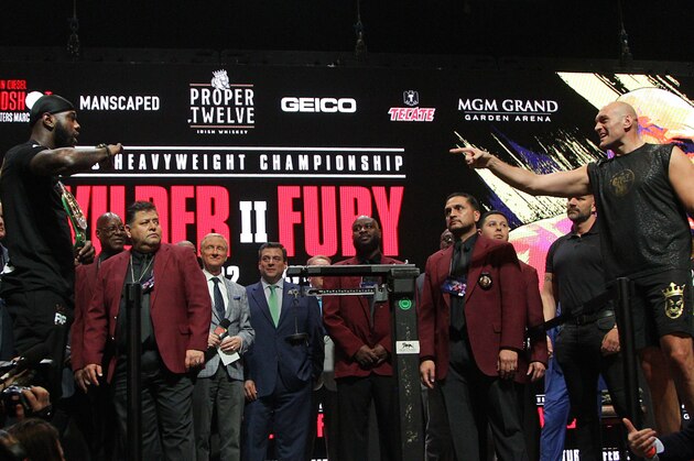 US boxer Deontay Wilder (L) and British boxer Tyson Fury (R) face off during their official weigh-in at the MGM Grand Las Vegas in Las Vegas, Nevada on February 21, 2020. - The boxers will fight for the World Boxing Council (WBC) Heavyweight Championship Title on February 22, 2020 at the MGM Grand Garden Arena in Las Vegas. (Photo by John Gurzinski / AFP) (Photo by JOHN GURZINSKI/AFP via Getty Images)