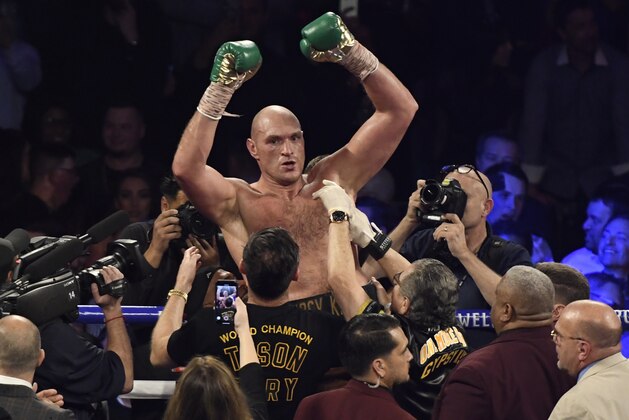 LAS VEGAS, NV - FEBRUARY 22: Tyson Fury cheers after going 7 rounds with Deontay Wilder at the MGM Grand Hotel February 22, 2020 in Las Vegas, Nevada. Las Vegas NV. Tyson Fury took the win by win TKO in the 7th round as the towel was thrown in from Wilder's corner for the world heavyweight championship in Las Vegas, Nevada.   (Photo by MB Media/Getty Images)