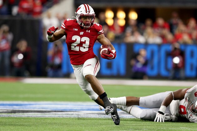 INDIANAPOLIS, INDIANA - DECEMBER 07: Jonathan Taylor #23 of the Wisconsin Badgers runs the ball in the Big Ten Championship game against the Ohio State Buckeyes at Lucas Oil Stadium on December 07, 2019 in Indianapolis, Indiana. (Photo by Justin Casterline/Getty Images)