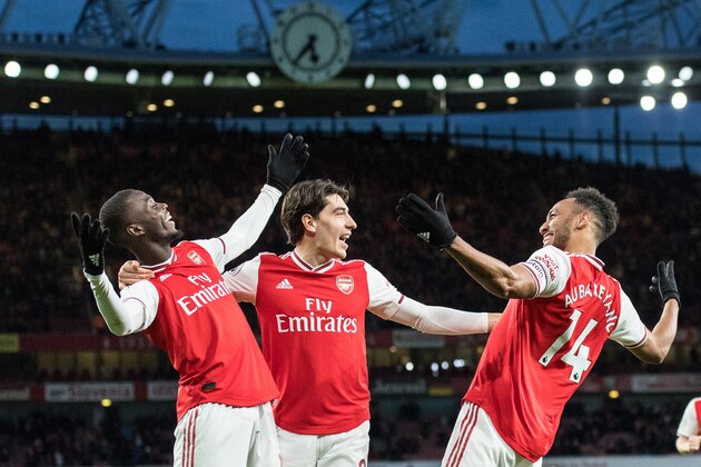 LONDON, ENGLAND - FEBRUARY 23: Pierre-Emerick Aubameyang of Arsenal FC celebrate with his team mates Nicolas Pepe, Héctor Bellerin after scoring his 2nd and his team's 3rd goal during the Premier League match between Arsenal FC and Everton FC at Emirates Stadium on February 23, 2020 in London, United Kingdom. (Photo by Sebastian Frej/MB Media/Getty Images) LONDON, ENGLAND - FEBRUARY 23: Pierre-Emerick Aubameyang of Arsenal FC celebrate with his team mates Nicolas Pepe, Héctor Bellerin after scoring his 2nd and his team's 3rd goal during the Premier League match between Arsenal FC and Everton FC at Emirates Stadium on February 23, 2020 in London, United Kingdom. (Photo by Sebastian Frej/MB Media/Getty Images)