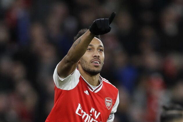 Arsenal's Pierre-Emerick Aubameyang celebrates after scoring his side's third goal during the English Premier League soccer match between Arsenal and Everton at Emirates stadium in London, Sunday, Feb. 23, 2020. (AP Photo/Kirsty Wigglesworth)