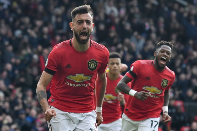Manchester United's Portuguese midfielder Bruno Fernandes celebrates scoring the opening goal from the penalty spot during the English Premier League football match between Manchester United and Watford at Old Trafford in Manchester, north west England, on February 23, 2020. (Photo by Paul ELLIS / AFP) / RESTRICTED TO EDITORIAL USE. No use with unauthorized audio, video, data, fixture lists, club/league logos or 'live' services. Online in-match use limited to 120 images. An additional 40 images may be used in extra time. No video emulation. Social media in-match use limited to 120 images. An additional 40 images may be used in extra time. No use in betting publications, games or single club/league/player publications. /  (Photo by PAUL ELLIS/AFP via Getty Images)