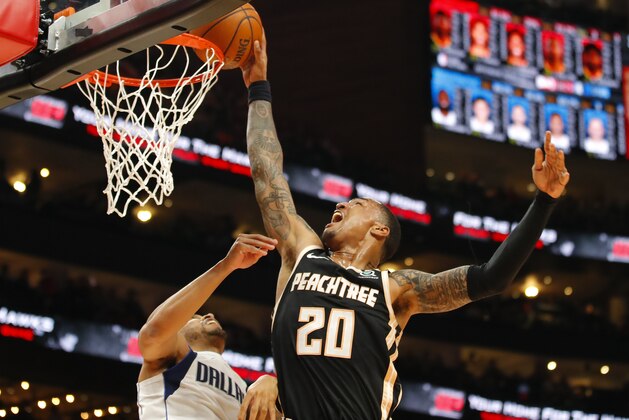 ATLANTA, GA - FEBRUARY 22: John Collins #20 of the Atlanta Hawks goes up for a shot during the second half of an NBA game against the Dallas Mavericks at State Farm Arena on February 22, 2020 in Atlanta, Georgia. NOTE TO USER: User expressly acknowledges and agrees that, by downloading and/or using this photograph, user is consenting to the terms and conditions of the Getty Images License Agreement. (Photo by Todd Kirkland/Getty Images)
