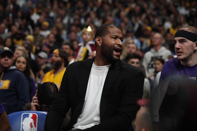 Injured Los Angeles Lakers center DeMarcus Cousins (15) in the second half overtime of an NBA basketball game Wednesday, Feb. 12, 2020, in Denver. The Lakers won 120-116 in overtime. (AP Photo/David Zalubowski)
