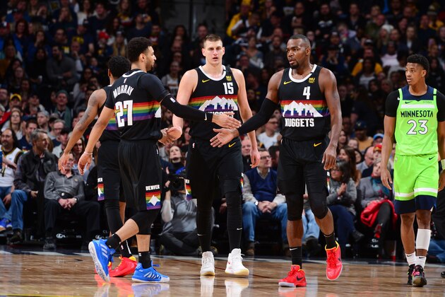 DENVER, CO - FEBRUARY 23: Jamal Murray #27 of the Denver Nuggets, Nikola Jokic #15 of the Denver Nuggets and Paul Millsap #4 of the Denver Nuggets high five during the game against the Minnesota Timberwolves on February 23, 2020 at the Pepsi Center in Denver, Colorado. NOTE TO USER: User expressly acknowledges and agrees that, by downloading and/or using this Photograph, user is consenting to the terms and conditions of the Getty Images License Agreement. Mandatory Copyright Notice: Copyright 2020 NBAE (Photo by Bart Young/NBAE via Getty Images)